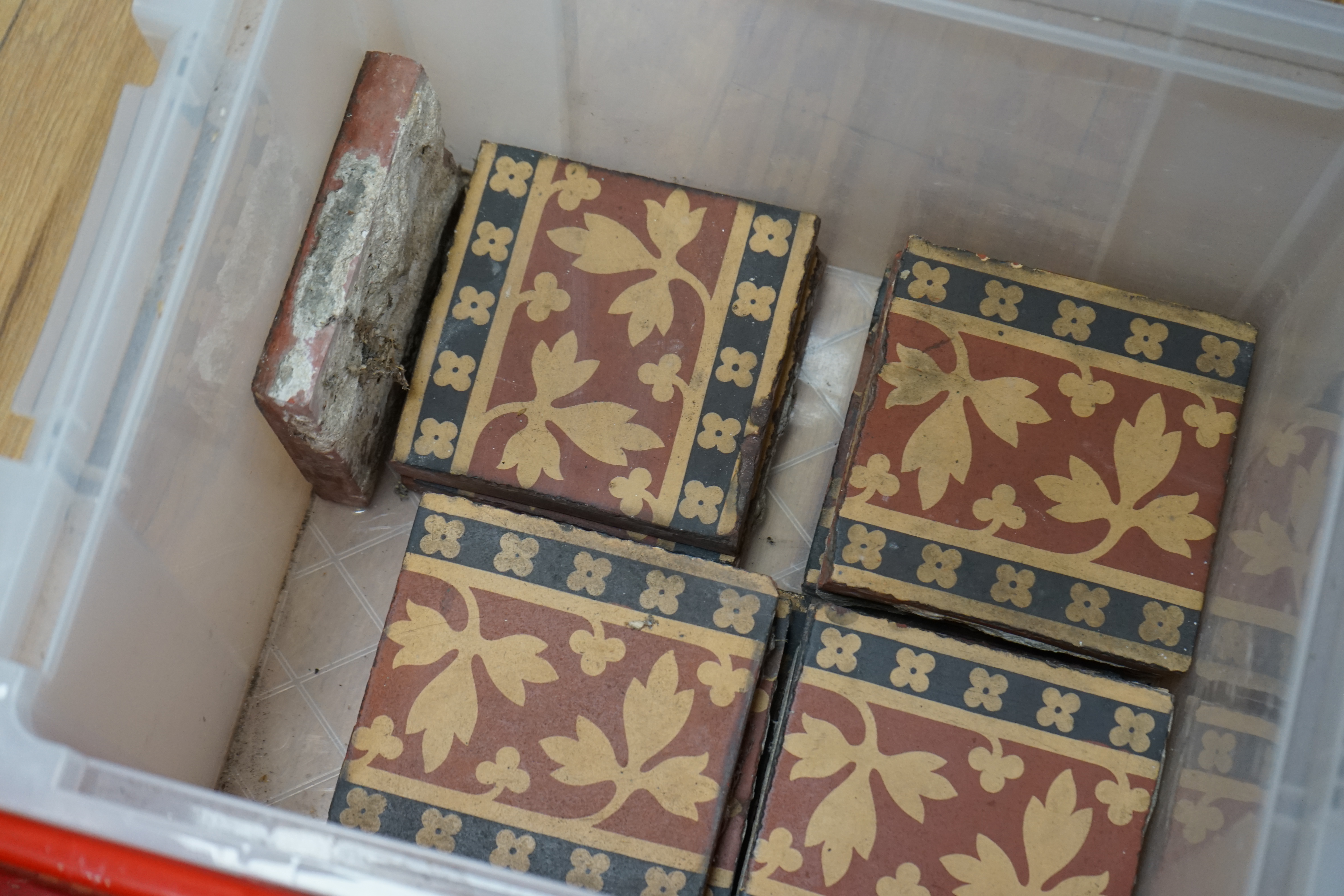 A W N Pugin encaustic tiles by Minton and Co, twenty six and one smaller, together with a group of four similar framed 19th century tiles. Condition - good